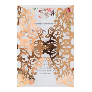 Laser-cut rose gold wedding invitation with floral insert and baroque scroll pattern