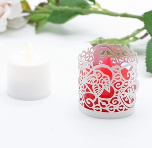 Detailed laser-cut paper lampshade with floral patterns for LED tea light candles