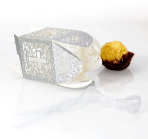 Silver laser cut cross candy box with glitter finish and decorative white ribbon