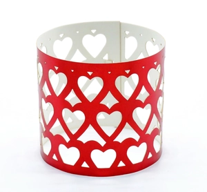 Detail of red hollow heart patterns on paper napkin rings for restaurant weddings