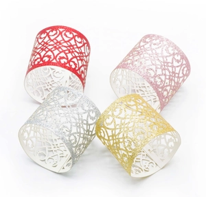 Detailed laser-cut glitter napkin rings in heart vine pattern, red silver and gold colors