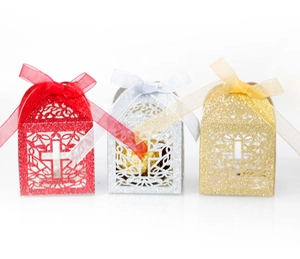 Detailed laser-cut cross design on red, gold, and silver glitter favor gift boxes