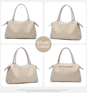 Détails du sac de voyage pied-de-poule kaki avec sangles en cuir et coins renforcés