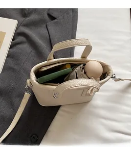 Top view of compact bucket bag showing internal capacity for umbrella and phone