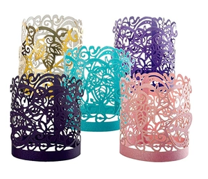 Detailed laser-cut leaf pattern on multicolored pearlescent paper candle sleeves