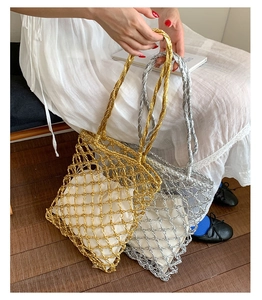 Detail of hand-woven metallic mesh bags in gold and silver with drawstring liners