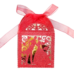 Glittery red laser-cut wedding candy box featuring bride and groom silhouette with ribbon