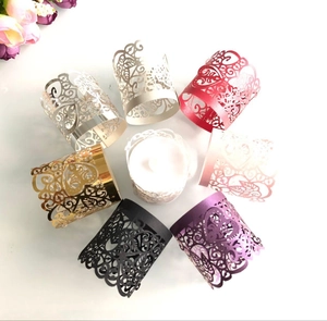 Laser-cut decorative paper sleeves with heart patterns in various vibrant metallic colors