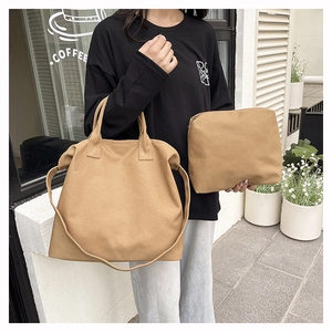 Detail view of the khaki canvas tote bag and matching zipper pouch for daily use