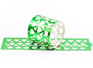 Green reflective paper napkin ring with laser-cut heart pattern for party table decoration
