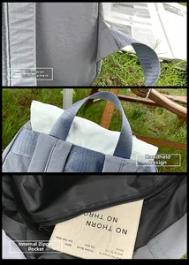Detail of reinforced triangle stitching, top handle, and interior zipper pocket on backpack