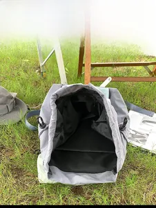 Internal capacity display of a grey nylon drawstring backpack for outdoor leisure travel