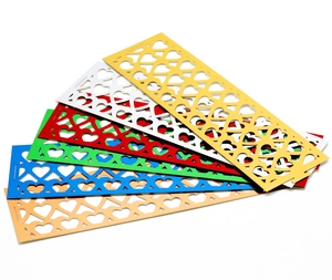 Detail showing heart-shaped hollow patterns on colorful paper napkin ring set