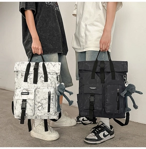 Macro detail of large capacity roll-top backpacks in marble pattern with side pockets