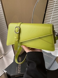 Lime green minimalist crossbody handbag with silver buckle and asymmetric geometric flap