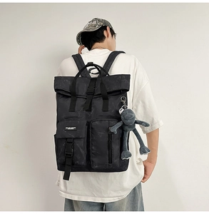 Outdoor leisure backpack with black marble pattern and roll-top closure shown on model