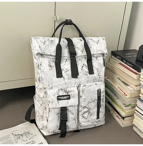 Detail view of large capacity backpack with unique black and white marble pattern design