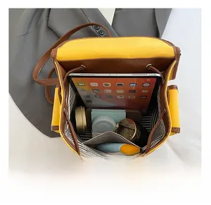 Detail showing high-capacity backpack with striped lining and drawstring closure