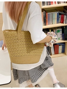 Large capacity woven straw tote bag with intricate lace hollow pattern for beach vacations