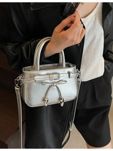 Silver metallic PU leather handbag with star pendant and crossbody strap for women