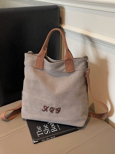 Vintage canvas tote bag in light grey with brown straps and AQG embroidery detail