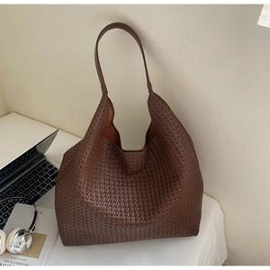 Detail showing high-quality woven texture of the large coffee brown leather hobo tote bag