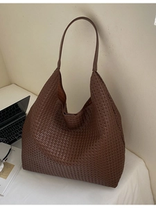 Large dark brown woven leather tote bag for women with minimalist hobo shoulder design