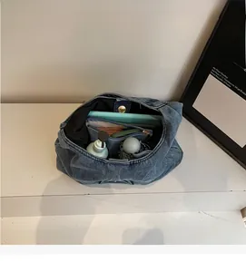 Deep blue denim tote bag interior showing large capacity for daily essentials