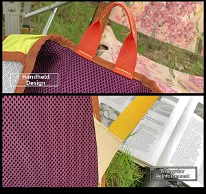 Détail des poignées en nylon et du renfort en toile sur un sac en filet violet