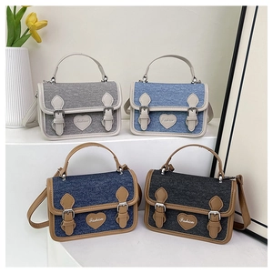 Fashionable denim crossbody bags in four colors with heart-shaped embroidery detail
