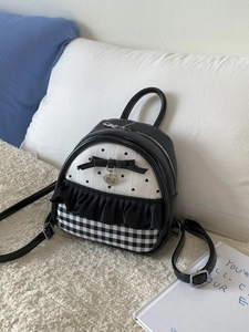 Sweet mini black leather backpack with heart pattern and bow accent for casual travel