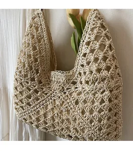 Close-up of beige woven tote bag with hollow crochet diamond pattern and inner lining