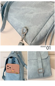 Detail of light blue denim backpack showing side phone pocket and metal buckles