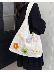Large knit tote bag with colorful 3D crochet flowers and wide strap for women