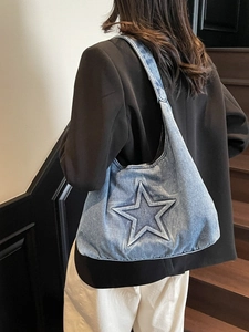 Retro blue denim tote bag featuring embossed star pattern for casual daily wear