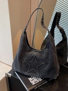 Charcoal grey denim tote bag with embossed star detail and retro casual shoulder strap
