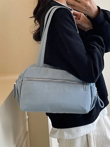 Minimalist light blue canvas tote bag with large capacity and shoulder strap for daily commuting