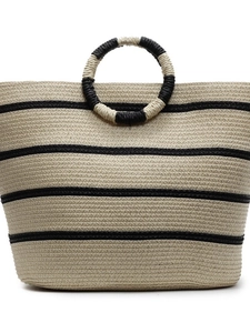 Handwoven straw tote bag with black stripes and circular handles for beach vacations