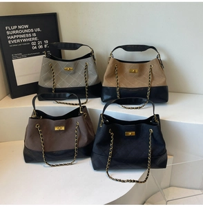 Collection of quilted chain handbags in gray, beige, brown and black with gold hardware