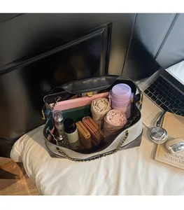 Spacious interior of tote bag showing laptop, water bottle, and daily essentials storage