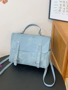 Light blue vintage high-capacity backpack with dual handle and adjustable straps