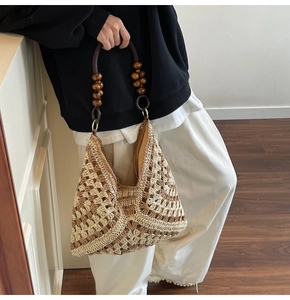 Detail of woven tote bag with diamond pattern, wooden beads and vintage texture