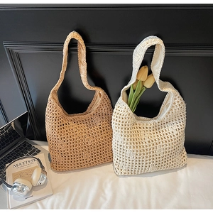 Close-up of hollow knit hobo bags in khaki and beige with soft fabric lining and cotton texture