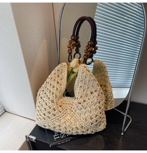 Detailed shot of hand-woven beige tote with dark brown wood beads on the handle
