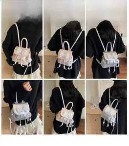 Mini backpack set featuring lace bow details and white plush pompom charm in various views