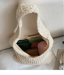 Detailed interior view showing large capacity for umbrella and phone in woven tote