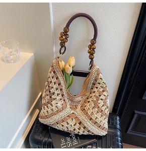 Detail of woven tote bag with contrast crochet pattern and decorative wooden beads