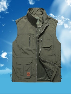 Detail of army green outdoor vest with functional zip pockets and breathable mesh lining