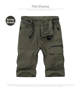Macro detail of army green cargo shorts with quick-dry fabric and utility zipper pockets