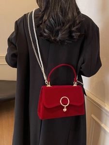 Elegant red velvet handbag with gold heart pendant and pearl chain strap for women